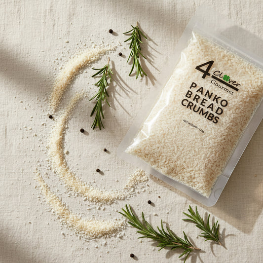 Package of 4 Clover Gourmet Panko Bread Crumbs with onion rings and ketchup on a white plate.