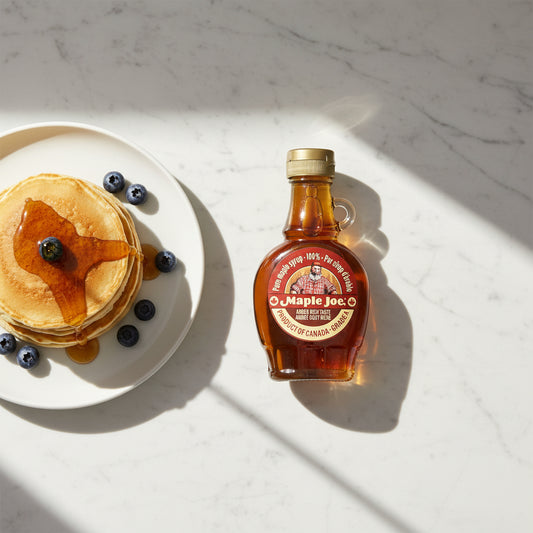 Bottle of Maple Joe syrup on a white background