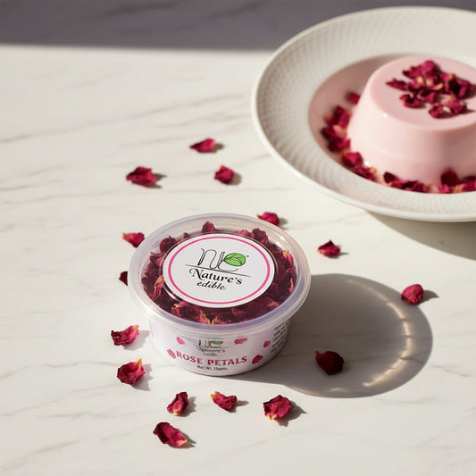 One containers of Nature's Edible rose petals on a bed of pink rose petals.