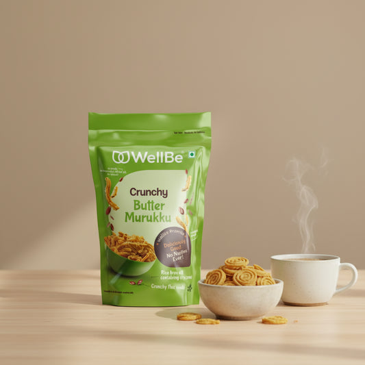 Green package of WellBe Crunchy Butter Murukku on a wooden surface with a blurred kitchen background.